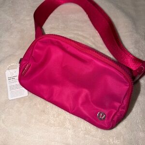 lululemon athletica Small Crossbody Belt Bag in Hot Pink